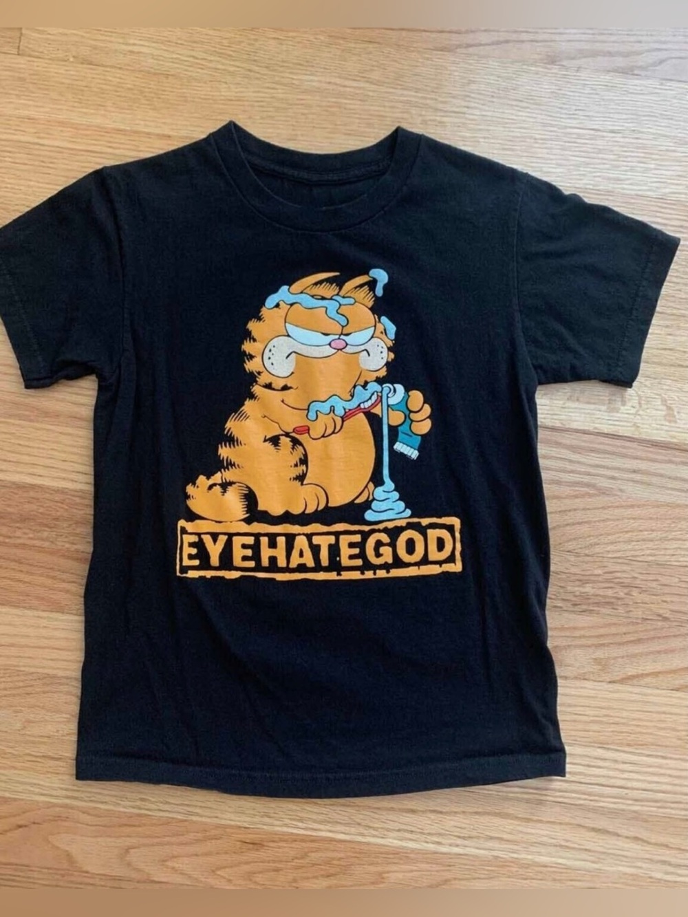 Black Graphic Tee with Orange Cartoon Cat